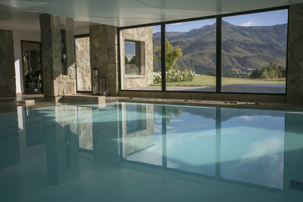 Swimming pool surrounded by stone walls at the resort