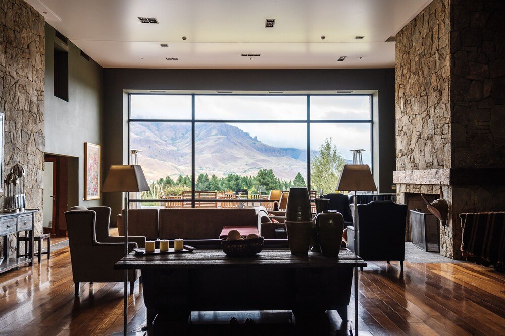 Spacious suite living room with a large window and sofas