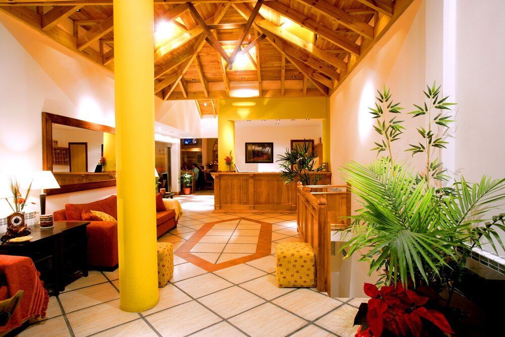 Spacious lobby with a high ceiling and reception