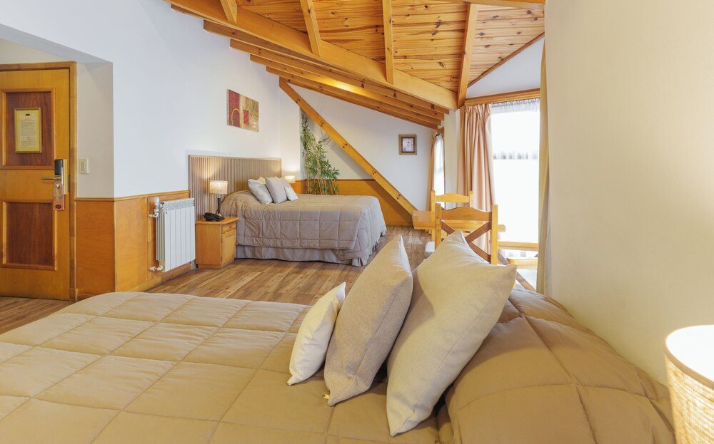 Bedroom with a large bed and a smaller bed
