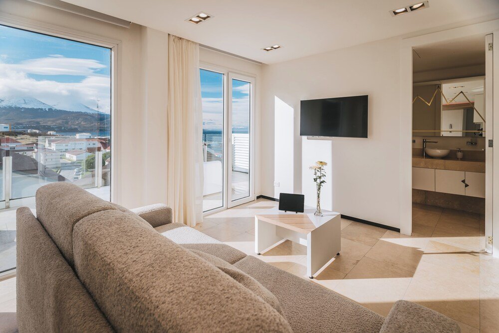Modern living room with a sofa, coffee table and TV