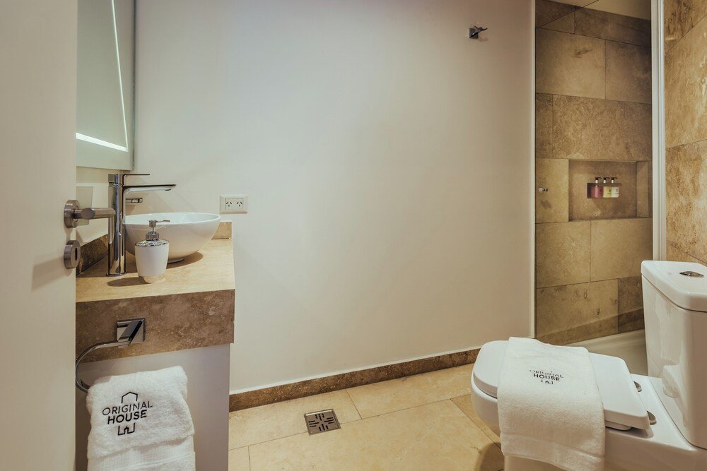 Modern bathroom with a sink, mirror and shower