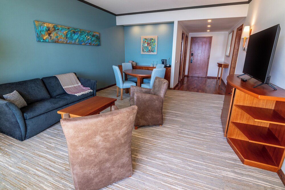 Modern living room with a sofa at Park Lake Luxury Hotel