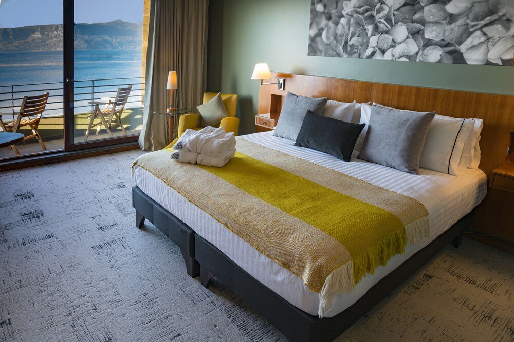 Hotel room with a bed and a view at Park Lake Luxury Hotel