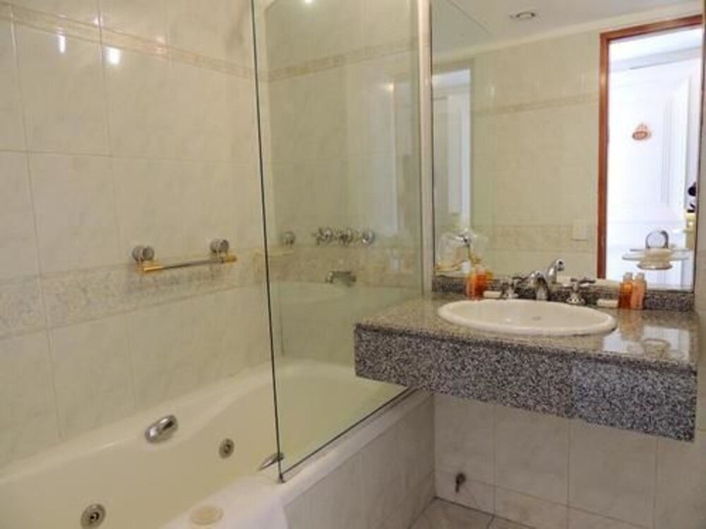 Bathroom with a glass-enclosed shower and modern fittings