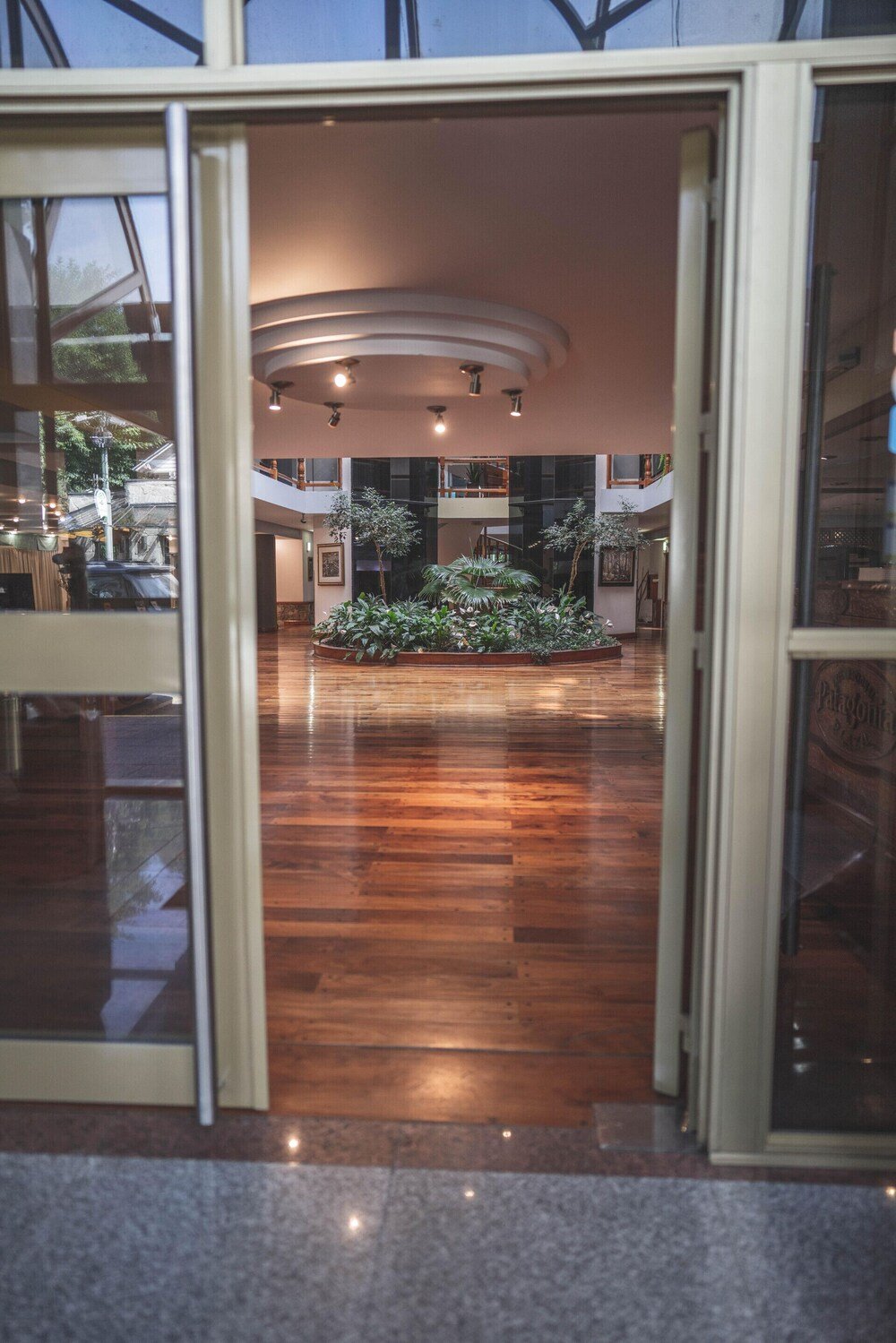 Hotel lobby seating area with a wooden floor