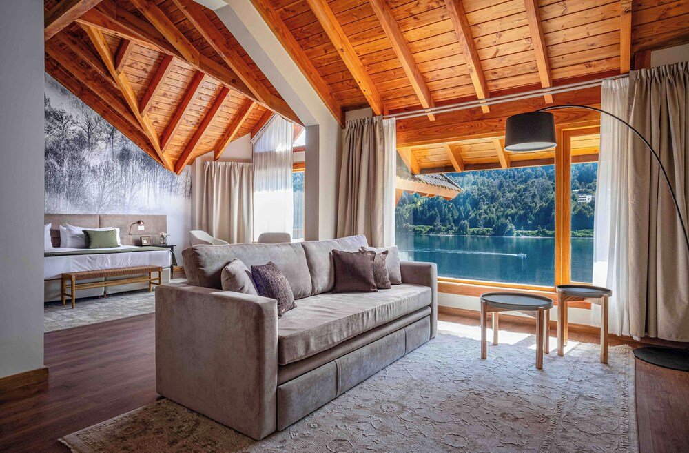 Cozy living room with a large window at Puerto Manzano Boutique Hotel