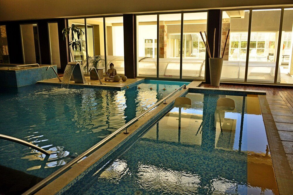 Indoor swimming pool with clear water at the hotel