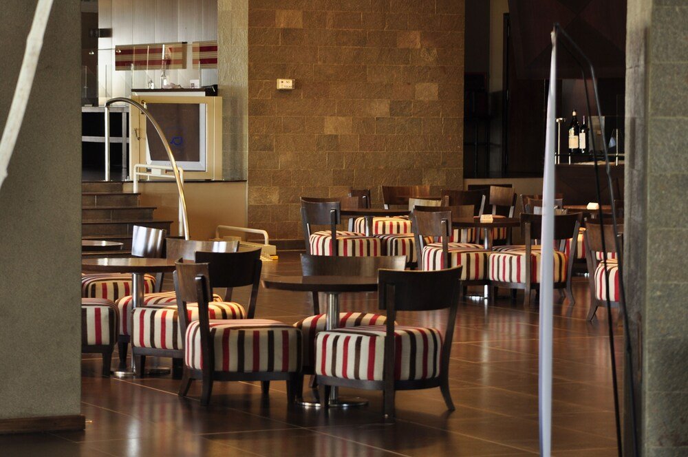 Spacious restaurant with striped chairs at the hotel