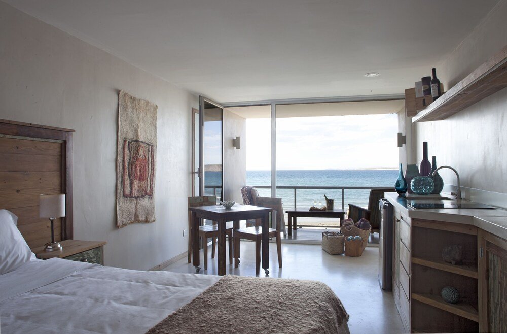 Bedroom with a large bed and a wooden nightstand