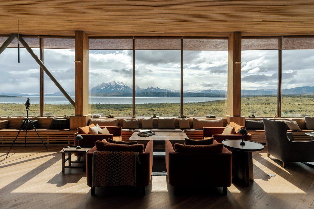 Spacious living area with large windows and a mountain view