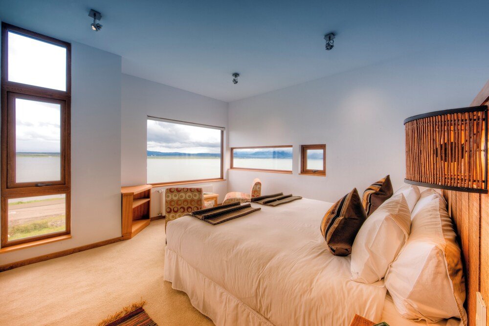 Bedroom with a large bed and a wooden headboard